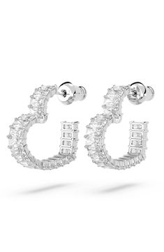 Baguette-cut pavé crystals trace these heart-shaped earrings in signature Swarovski shine and will add a romantic glow to any look, day or night. 5/8" drop; 1/8" width Post back Rhodium plate/Swarovski crystal Imported Swarovski Heart Earrings, Swarovski Jewelry Earrings, Glitter Accessories, Swarovski Heart, Silver Diamond Earrings, Expensive Jewelry Luxury, Heart Earring, Heart Hoop Earrings, Earrings Heart