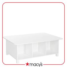 a white coffee table with three cubbys on top and the words macy's below it