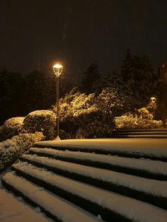 the steps are covered in snow at night