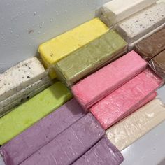 there are many different colored bars of ice cream