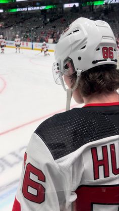 the hockey player is waiting for the next play to be taken down by the referee