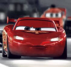 the cars are driving down the road in disney pixar's cars movie