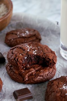 chocolate cookies and milk are on the table