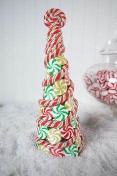 candy canes stacked on top of each other in the snow