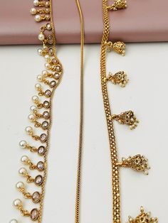 Get the simple and elegant kamarpatta that goes with your saree, half saree or even jeans with crop tops. The possibilities are endless .  This is free size and will easily fit sizes 4 to 16 . 4 options are available. Pattern1: Kundan and pearls Patttern 2 : simple and trendy gold plated snake chain . Perfect for jeans and crop top look! Option3 : Jhumka style all gold plated Option 4: Moti / Pearl chain gold plated  Easily adjustable.  The gold plated design Elegant Tilla Bridal Belt For Festivals, Festive Latkans Waist Chain For Wedding, Elegant Bridal Belt For Diwali Festival, Elegant Bridal Belt For Diwali, Elegant Waist Chain For Wedding And Festivals, Elegant Festive Bridal Belt With Tilla, Elegant Festive Waist Chain, Traditional Waist Chain With Latkans For Festive Occasions, Traditional Festive Waist Chain With Latkans