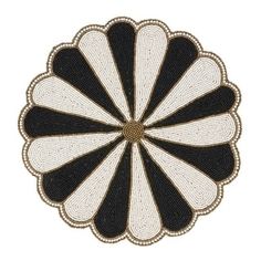 an embroidered black and white flower on a white background