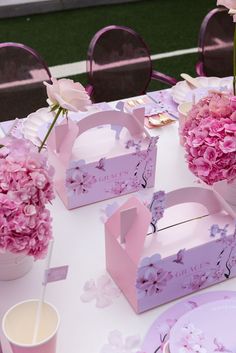 the table is set up with pink flowers