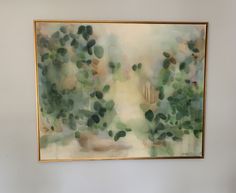 a painting hanging on the wall in a room