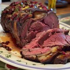 a large piece of meat sitting on top of a white plate