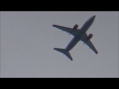 an airplane is flying in the sky with it's landing gear down and two engines out