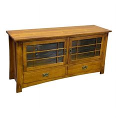 a wooden entertainment center with glass doors and drawers