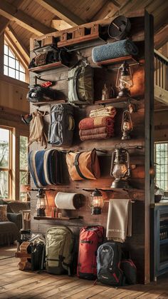 A farmhouse-styled room with a wooden camping gear wall, organizing outdoor gear in a charming, rustic way. Camping Gear Wall, Gear Room Organization, Gear Room Ideas, Outdoor Gear Organization, Outdoor Gear Storage, Adventure Room, Gear Wall, Gear Room, Countryside Home