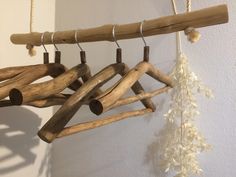 a wooden wind chime hanging from a rope