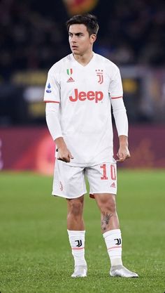 a man standing on top of a soccer field