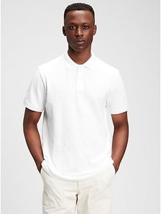 Soft, stretch pique knit with moisture-wicking properties.  Short sleeves with flat rib-knit cuffs.  Flat rib-knit polo collar.  Button placket.  Side vents at hem.  #223627 Straight, easy fit.  Hits at the hip.  Models are 6'1"–6'2" 185-188 cm) with a 31" 79 cm) waist and 32–33" 81–84 cm) inseam, and are wearing Gap Classic Fitted Gap Tops, White Casual Polo Shirt With Seamless Collar, Casual White Polo Shirt With Seamless Collar, Relaxed Fit Collared Polo Sweater, Solid Collared Polo Sweater With Relaxed Fit, Relaxed Fit Solid Polo Sweater With Collar, Fitted Collared Gap Tops, Gap Collared Top With Placket, Classic Solid Color Gap Tops