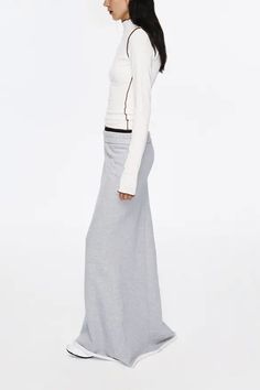 Unveil Laid-back Luxe with Textured Layers Elevate your wardrobe with this ribbed dual-waistband fleece lined mermaid skirt, a testament to comfort meets contemporary design. Crafted from high-weight fleece for a soft and snug feel, this piece boasts a ribbed upper waist that adds a textural dimension while the deliberately widened lower waistband exudes a casual, relaxed vibe. The mermaid tail with a rolled hem injects a carefree, chic look to this versatile piece, perfect for pairing with a sl Low Waist Maxi Skirt, Mermaid Maxi Skirt, Textured Layers, Mermaid Skirt, Mermaid Silhouette, Comfort Wear, Rolled Hem, Mermaid Tail, Casual Tee