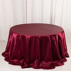 a round table with a red cloth on it