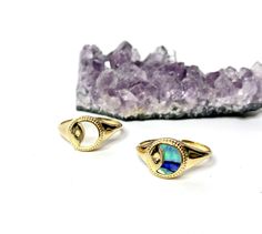 The Planets align with these beautiful signet rings with inlaid mother of pearl . Great for the star gazer in your life! This listing is only for one ring. These rings are only in one size which is a size 6 open back ring. Please see picture for details. Size 6 14kt gold plated ! ---------------------------------------- This item comes gift wrapped in signature BC wrapping and free gift. Also comes with a FREE GIFT!! Opal Eyes, Planet Ring, Saturn Necklace, Ring Moon, Star And Moon Necklace, Planet Necklace, Moon Ring, Free Bracelet, Charm Rings