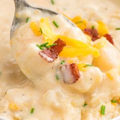 a spoon full of mashed potatoes and bacon