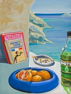 an oil painting of food and drink on a table next to the ocean with cliffs in the background