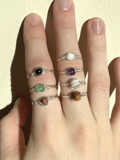 Mini Minimalist Wire Wrapped Ring :) These rings are made out of premium quality TARNISH RESISTANT 24 gauge silver and gold plated wire Your choice of 2 mm or 3 mm round gemstones. Options include: - Amethyst (2 mm) - Moonstone (2 mm) - Green Aventurine (2 mm) - Tigers Eye (3 mm) - Freshwater pearl - synthetic (3 mm) - Hematite (2 mm) - Unakite (2 mm) ✤ Care ✤ Due to the structure of natural gemstones (some are more porous, softer etc.) it is best to keep away from water, soaps, perfume, lotions Minimalist Metal Crystal Ring For Gift, Adjustable Metal Midi Rings For Everyday, Adjustable Stackable Metal Rings, Adjustable Simple Design Midi Rings With Round Band, Simple Adjustable Hypoallergenic Stackable Rings, Adjustable Minimalist Metal Midi Rings, Adjustable Hypoallergenic Metal Ring, Adjustable Hypoallergenic Midi Rings, Adjustable Simple Design Midi Rings