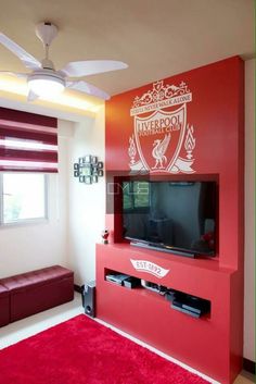 a living room with a red carpet and tv