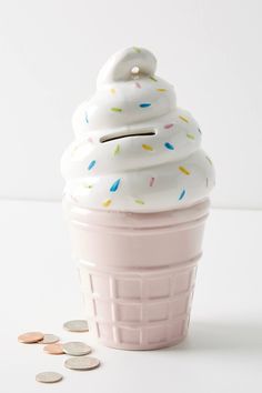 an ice cream cone with sprinkles and coins