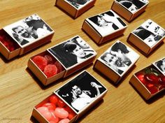 several small boxes filled with candies on top of a wooden table