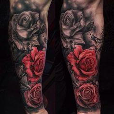 tattoos on both legs with roses and leaves