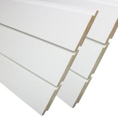 white plastic sheets stacked on top of each other in front of a white background,