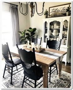 the dining room is decorated with black and white decor, including chairs and a table