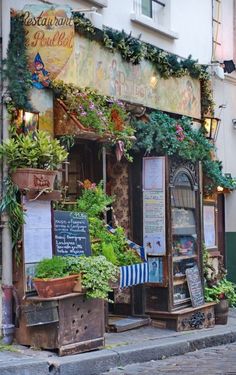 an old building with plants growing out of it