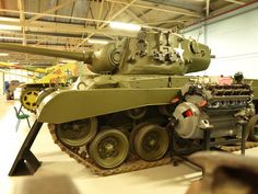 an army tank is on display in a museum