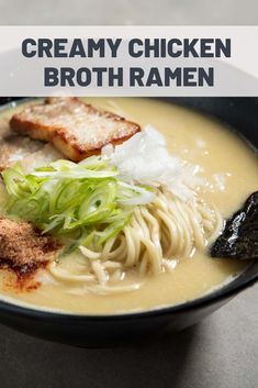 creamy chicken broth ramen in a black bowl