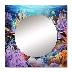 a mirror that is sitting on top of a wall with seaweed and corals