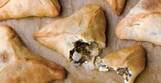 several pastries are laying on a baking sheet