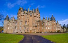 an old castle is shown on a sunny day