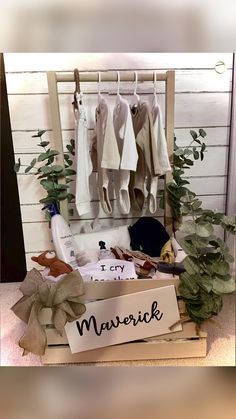 an open box with clothes hanging on the wall next to a sign that says i cry mavorich