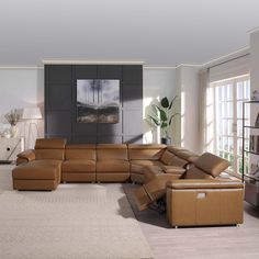 a living room filled with lots of brown furniture