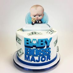 a baby boss cake with money on top