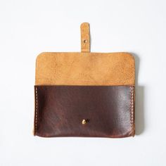 Details Made in America (in our Atlanta studio) 8.5 inches by 4.5 inches with a 1-inch gusset 100% full-grain leather, unlined Solid brass button stud Can be monogrammed The KMM & Co. clutch wallet comes in a wide variety of colors to match your favorite tote. It features four card slots, which can each hold multiple cards, and a divided interior to keep your phone and keys separate. The clutch wallet is the perfect piece to reach for whether you want to keep your essentials organized in you Classic Leather Envelope Coin Purse, Leather Envelope Coin Purse With Coin Pocket, Leather Trifold Wallet With Coin Pocket In Envelope Shape, Leather Trifold Wallet With Coin Pocket, Leather Envelope Wallet With Interior Card Slots, Leather Bifold Pouch With Card Slots, Hand-stitched Leather Rectangular Coin Purse, Hand-stitched Rectangular Leather Coin Purse, Leather Coin Purse With Card Slots