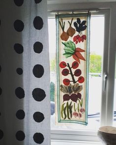 the curtains are decorated with black and white polka dot fabric, which is hanging in front of a window