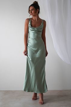 Highlights Gorgeous satin maxi dress with cowl neckline Beautiful open-back detail Ruched waist Also available in Blue Sizing The model is 5'10 and wears UK size 8 / S / US size 4 Fit & Fabric Made from 100% Polyester Hidden side zipper True to size Length from top of shoulder to hem: 138cm Stretch:  5/10 Perfect f Sage Dresses Bridesmaid, Silk Dress Maxi, Light Green Bridesmaid Dresses, Sage Green Bridesmaid, Oh Hello Clothing, Dress Sage Green, Orange Bridesmaid, Sage Bridesmaid Dresses, Bridesmaid Dresses Satin