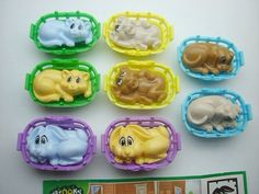 there are many plastic toys in the shape of animals