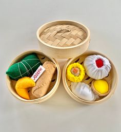 three wooden bowls filled with different types of food