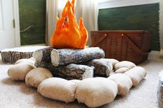 a pile of logs sitting on top of a carpet