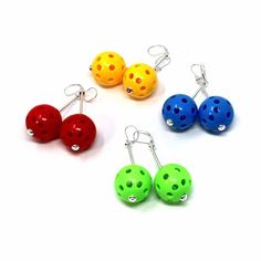 four pairs of earrings with different colors