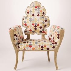 an ornately decorated chair is shown against a white background with circles and dots on it