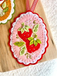 an ornament is hanging on a wooden board