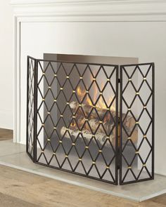 a fireplace screen with logs in it